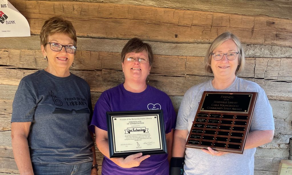 Carol Ann Engskov and Carol Youngblood present the Carla Young Community Spirit Award to Ann Richardson.